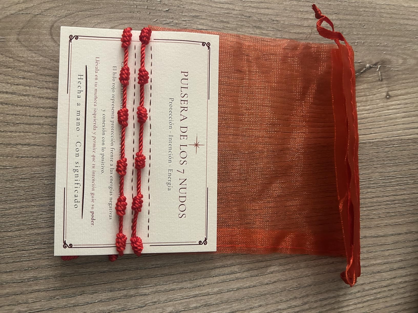 Pulsera de los 7 nudos RAIAN con tarjeta de significado y bolsa roja